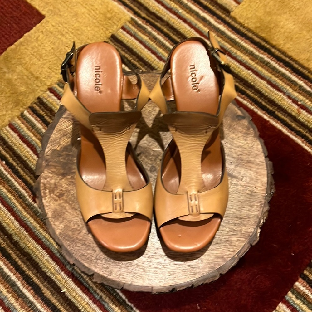 Brand new leather, Nicole wedge sandal with orange detail on the heel size 9.